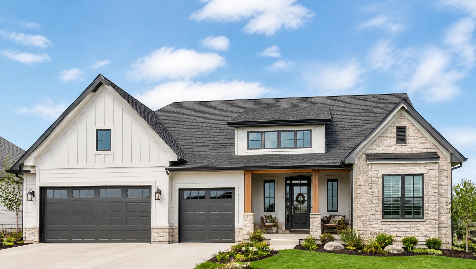 Bright daytime view of a Utah home exterior with a well-maintained shingle roofline under a clear sky
